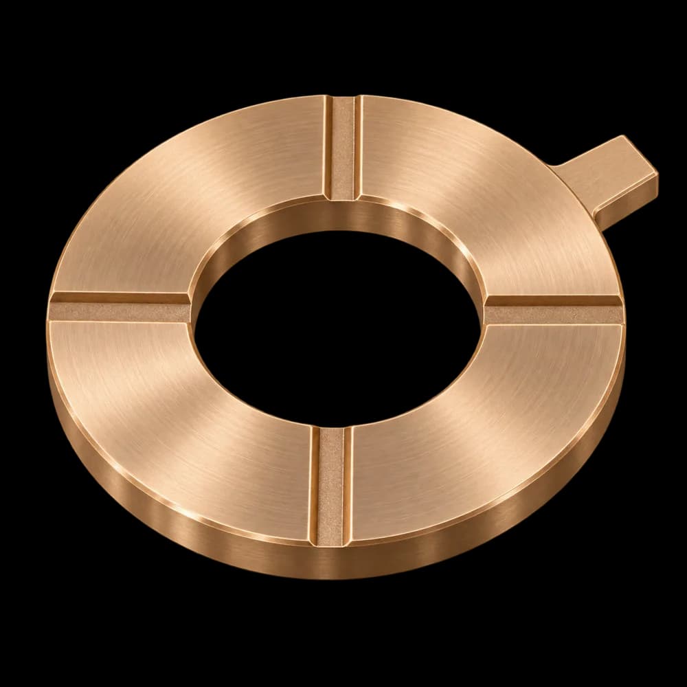 CNC milled C51000 phosphor bronze thrust washer with four grease grooves and an anti-rotation tab