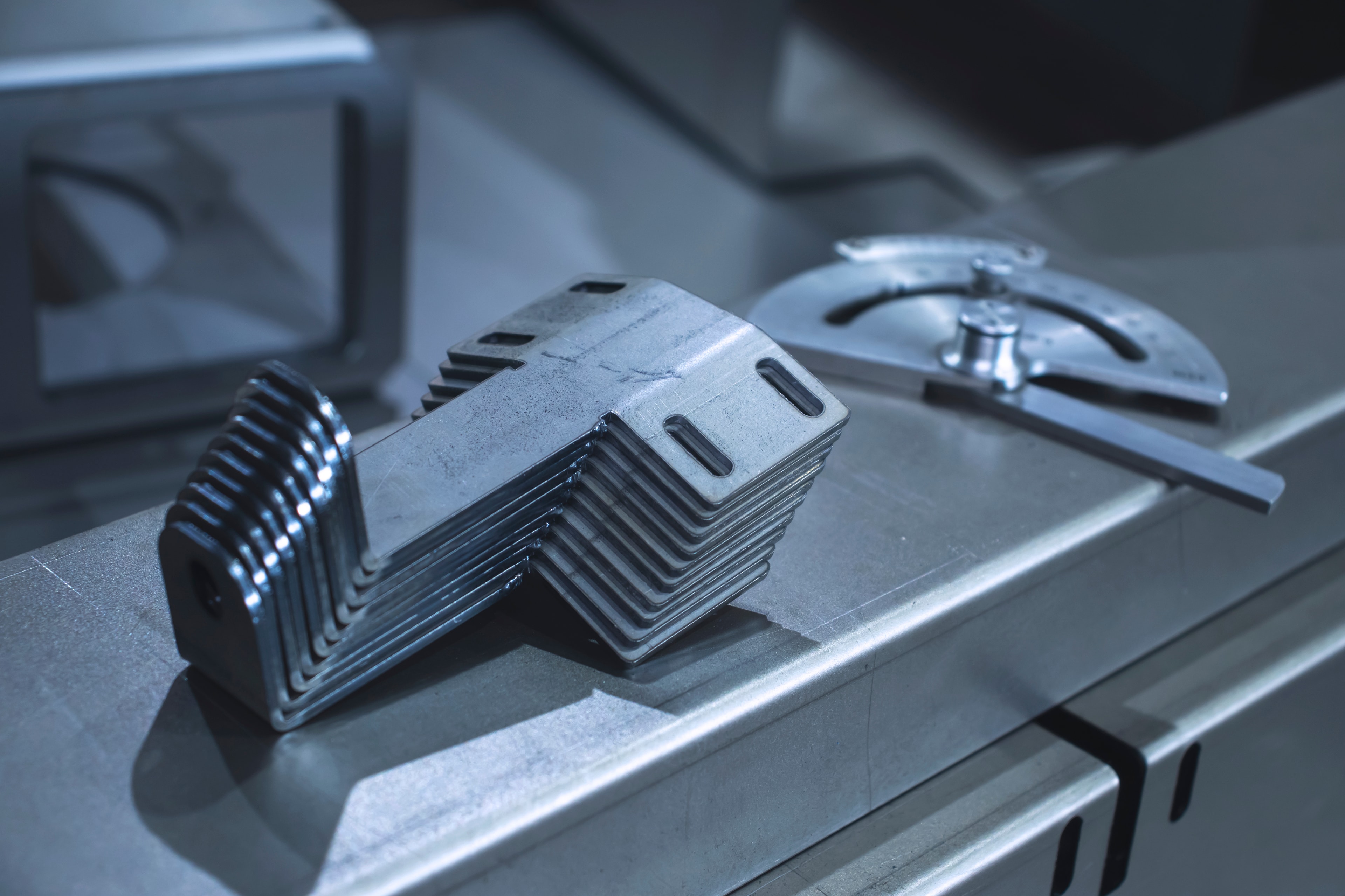 Sheet metal fabrication process forming and assembling precision metal components