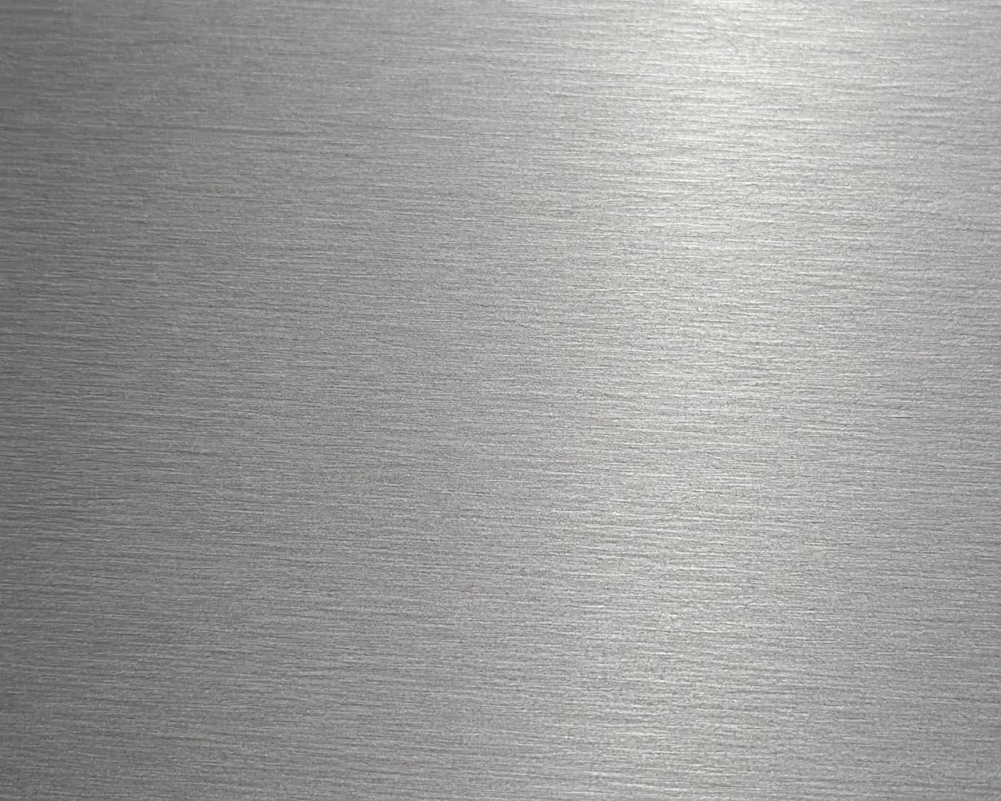 Sanded surface on machined or fabricated part