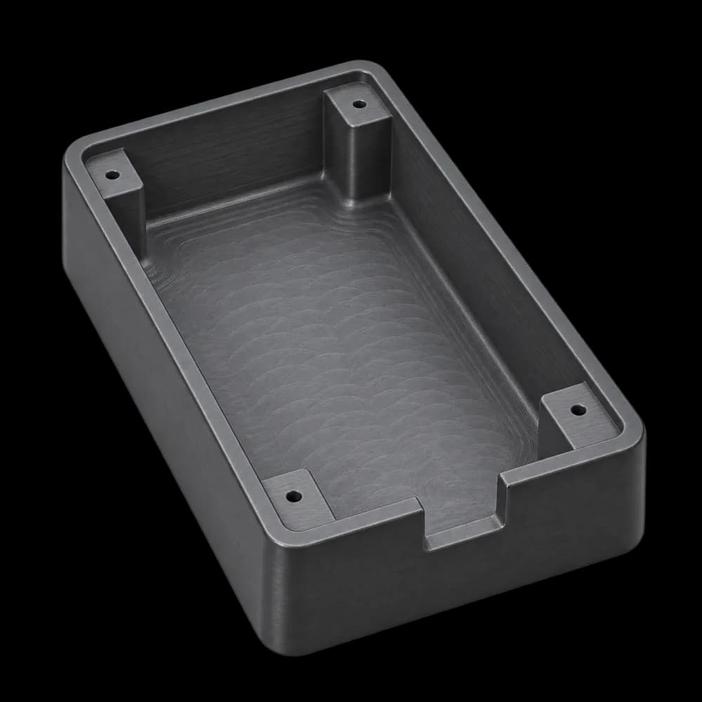 CNC milled ABS plastic electronics enclosure with four screw bosses and a cable cutout