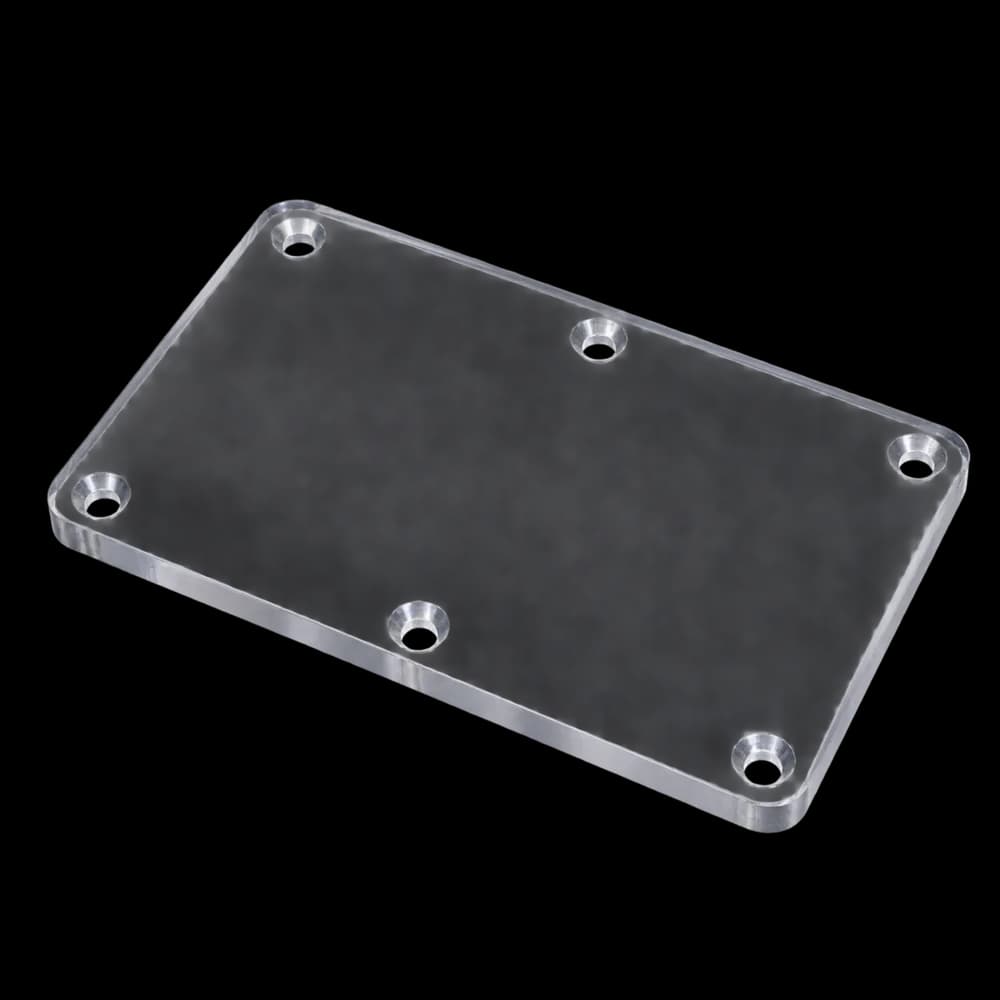 CNC milled clear polycarbonate guard window with six countersunk holes