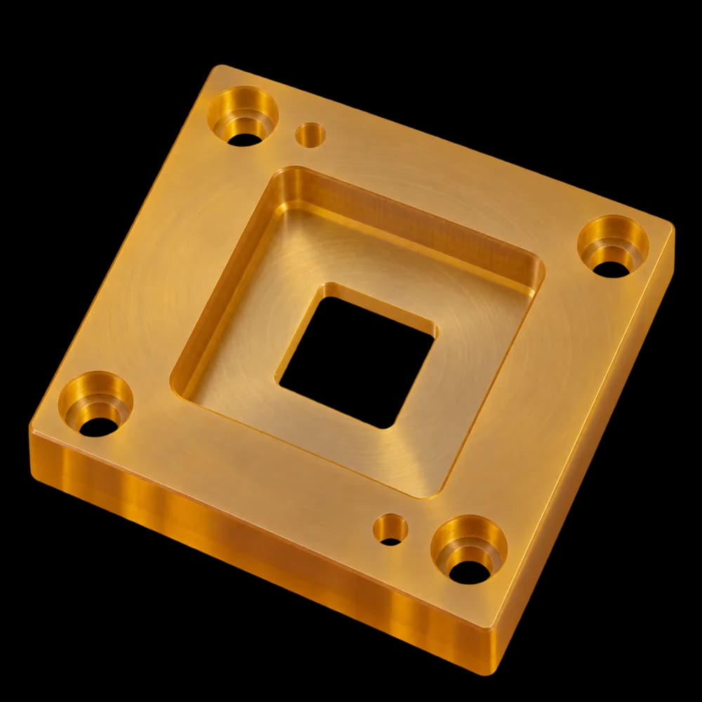 CNC milled amber ULTEM test nest with a stepped pocket, through window, four counterbored holes and two dowel holes