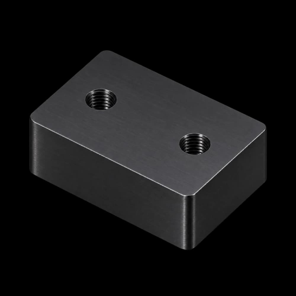 The same 6061 aluminum block with tapped holes and black anodizing