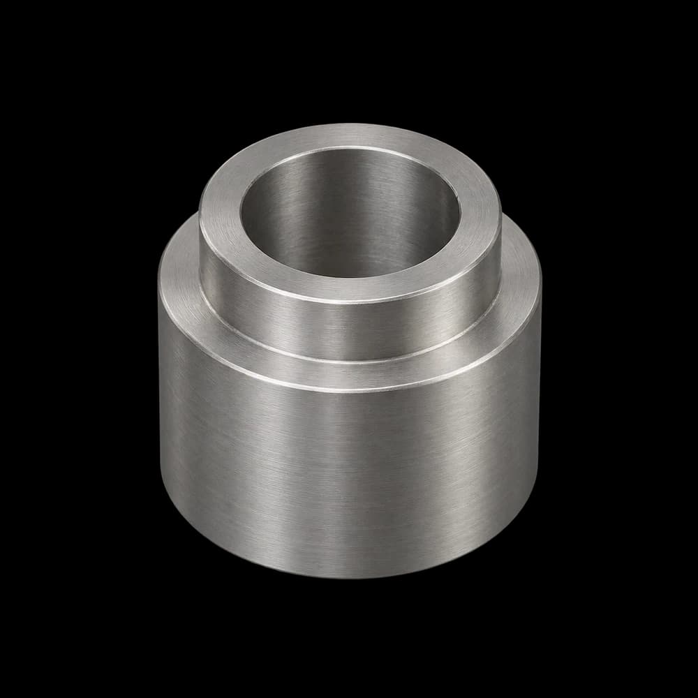 Illustrative CNC-turned stepped steel bushing