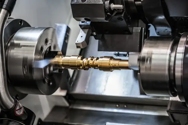 CNC turning process machining precision cylindrical metal components with tight tolerances